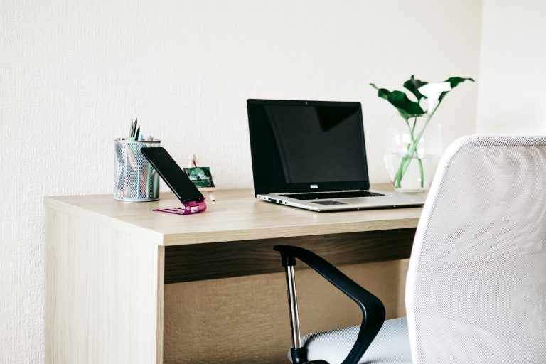 Canva - Laptop Computer on Brown Wooden Desk