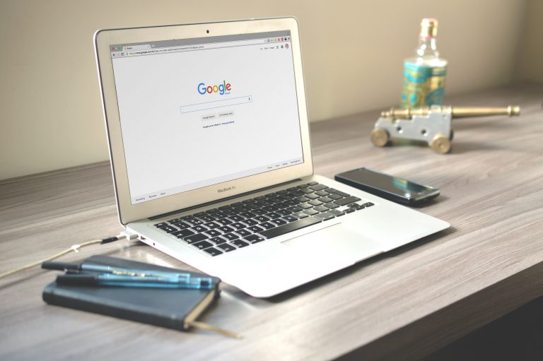 Canva - Macbook Air on Grey Wooden Table